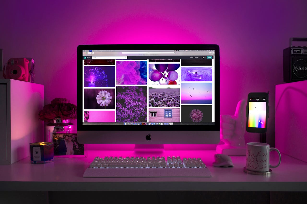The Art of Drawing Readers In: Your attractive post title goes here Modern desk setup with neon lighting and a desktop computer displaying colorful images.